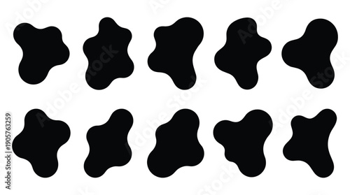 Black irregular shapes on a white background, abstract design elements