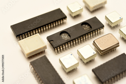 Old chips on a white background. Electronic components. Processors in metal and plastic cases.