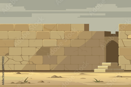 Ancient stone wall with doorway and stairs in desert