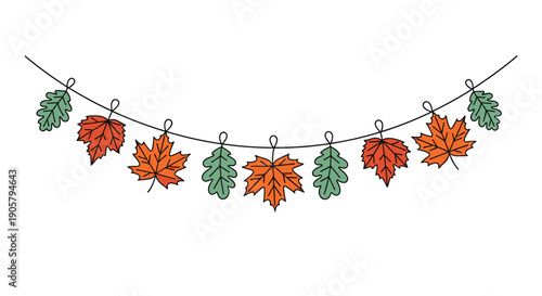 Autumn leaf garland with colorful maple and oak leaves hanging on a string for fall season home decoration.