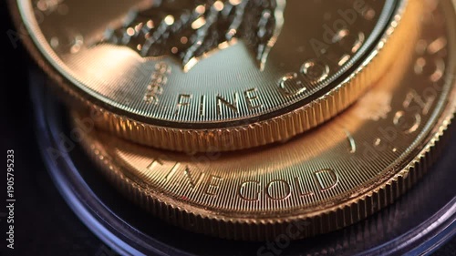 Two gold coins lying on top of each other, illustrating the concept of rising gold prices, futures contracts or gold funds, and gold as a safe-haven financial asset.