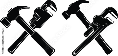 Two sets of crossed tools including a hammer and a wrench in silhouette