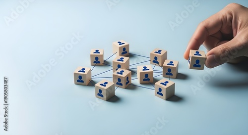 Organizational network structure with connected people icons on wooden blocks, showing team collaboration, stakeholder mapping, social graph, and business communication on a light background