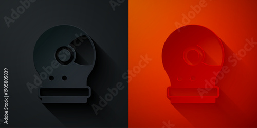 Paper cut Astronaut helmet icon isolated on black and red background. Paper art style. Vector
