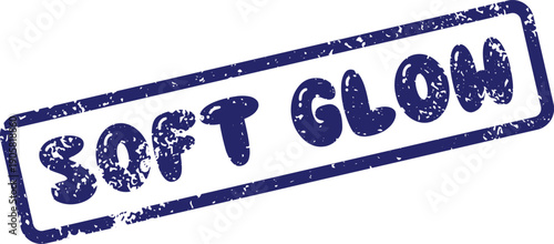 Distressed navy blue SOFT GLOW rubber stamp impression on a clear white surface
