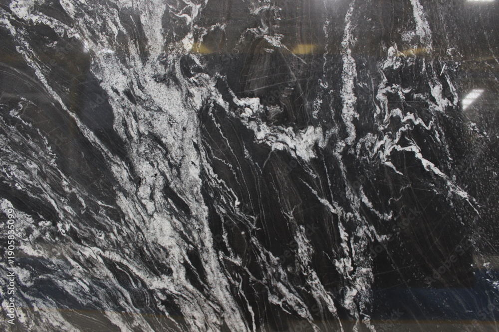 Fototapeta premium Copacabana black marble texture with expressive white vein patterns and sharp contrast, exotic natural stone from Brazil for wall and floor.
