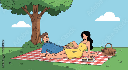 Young couple having a picnic on a blanket under a green tree