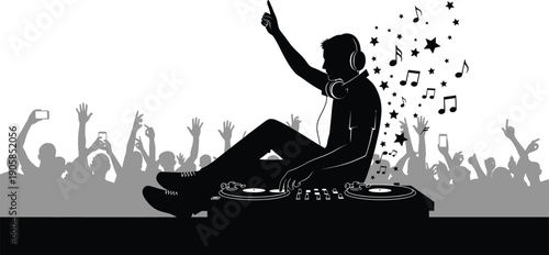 DJ sitting on sound mixer with headphones on and hand raised in front of cheering crowd with mobile phones  music festival scene