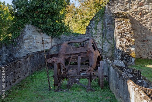 Quadro em tela Rusted cars in destroyed and martyred village Oradour sur Glane in France, a massacre in june 1944 during the scecond world war