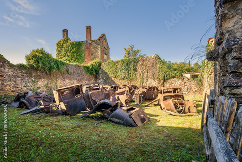 Quadro em tela Rusted cars in destroyed and martyred village Oradour sur Glane in France, a massacre in june 1944 during the scecond world war