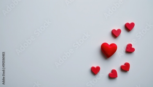 Red Heart Shaped Objects Arranged on a Light Background for Love and Romance Themes