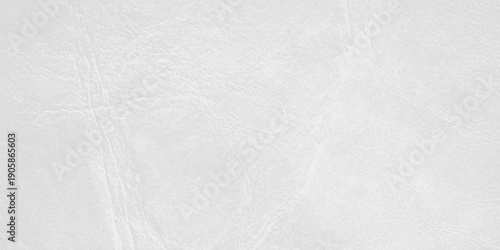 A seamless blank white marble and textured paper surface creates an empty grey pattern on a rough grunge material backdrop for a clean canvas wall design