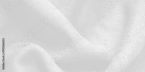 A clean closeup of soft white cotton linen fabric texture creates a blank material backdrop with a winter snow pattern and a textured grey paper surface design