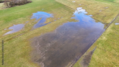 Fotografia Aerial View of Flooded Agricultural Field with Standing Water