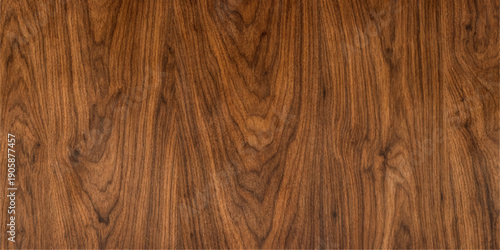 A dark brown oak timber board showcases a natural grain pattern and textured hardwood surface, creating a rustic wooden panel background ideal for nature-inspired furniture or floor design