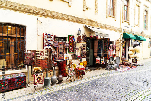 Antique shop in Icherisheher, in the old city of Baku. Antique carpets, pillows, women's shawls, bags, handmade dishes made of iron and copper, various souvenirs are on sale. Souvenirs in the Old City