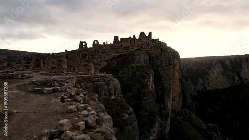 Ancient Castle Ruins on a Dramatic Cliff Edge at Dusk.