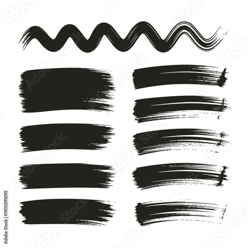 Abstract black brush strokes and lines arranged in rows on white
