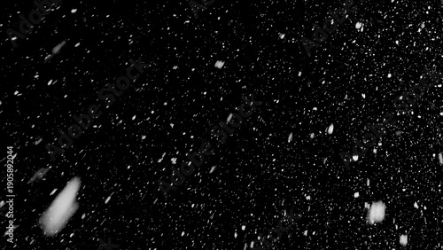 Freeze motion of natural snow falling on black background