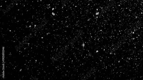 Freeze motion of natural snow falling on black background