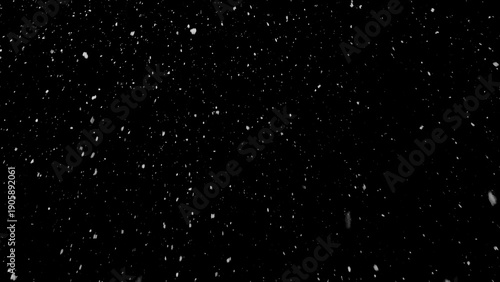 Freeze motion of natural snow falling on black background