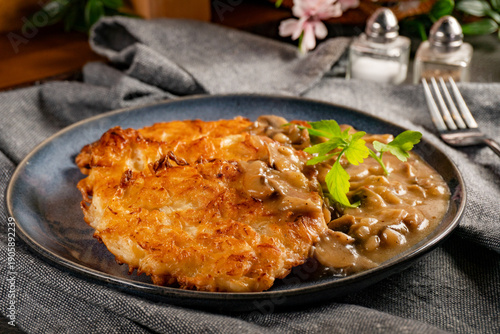 Sauerkraut pancakes (fuczki) with mushroom sauce - a traditional Lemko dish.