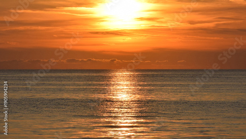 Golden sunset over a calm sea.