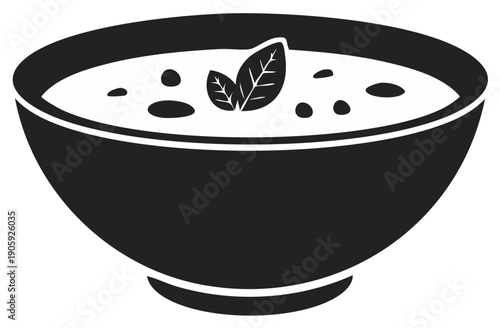 Bowl of soup with garnish of basil leaves, healthy food concept