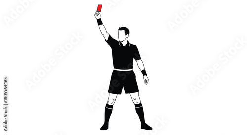 Soccer referee displays a red card in a stark silhouette