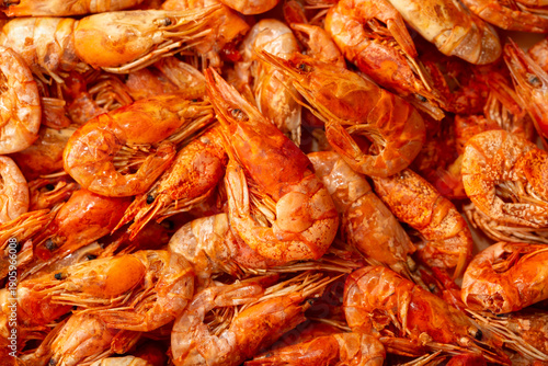 Shrimp close-up in a large pile. Smoked and salted shrimp with spices for a beer snack.