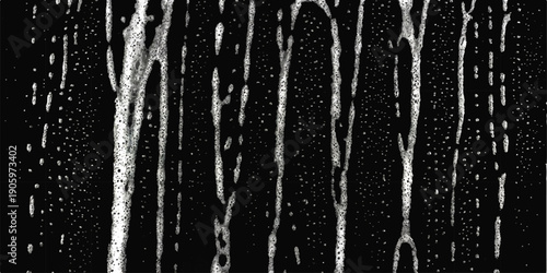 Abstract vertical streaks of white foam and bubbles on a dark black background, representing liquid or soap suds texture