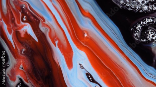 Abstract unique background flowing waves, water ripples, marble, moving multicolored liquid paint of red, blue, white colors.