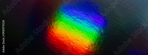 Abstract rainbow gradient with vibrant colors and textured surface for digita...