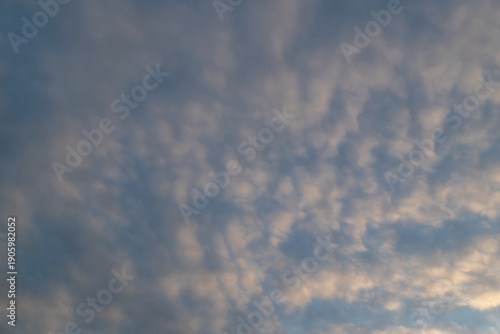 Calm Blue Sky With Soft Clouds Above Open Horizon For Serene Stock Photo