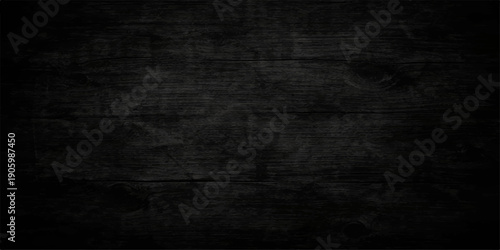 A dark antique chalkboard wall texture features a rough aged paper design with a blank dirty black surface and vintage gray grunge pattern for a textured backdrop