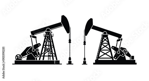Two oil pumps in a stark contrasting black silhouette