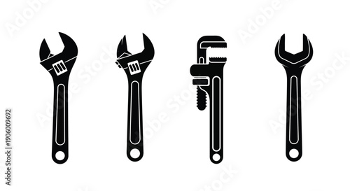 Four wrench tools displayed in a striking black silhouette