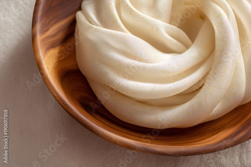 minimalist home decor, sophisticated serene setting with ivory silk scarf, small gold detail, light wood tray, and ample open space