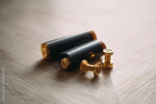 photography equipment, calm flat lay with exposed film roll, brass tripod, wooden texture, and soft natural light