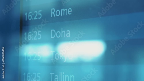 Flight schedule display board showing various international destinations including Stockholm, Vilnius, and Rome with departure times visible in a modern airport setting