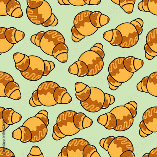 Croissants pattern with sweet glaze on green background