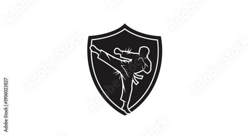 Martial artist performing a kick within a shield shape silhouette