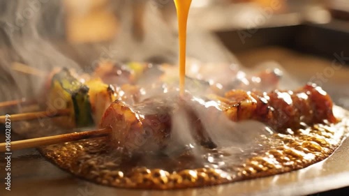 Sizzling meat skewers being glazed with savory sauce on grill