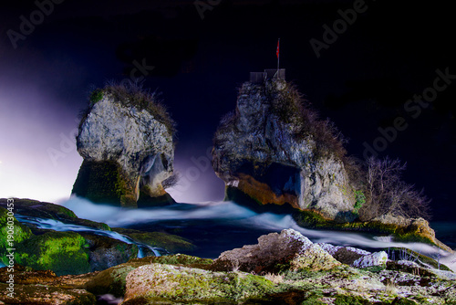 Wallpaper Mural Rugged coastline features stone formations and cascading water with fog Torontodigital.ca