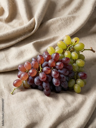  Small cluster of grapes on linen fabric, soft texture
