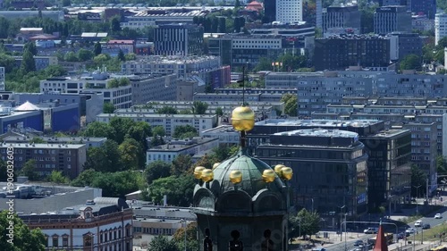 Golden Spire Orbit: 360° View of Historic Wrocław and Urban Horizon