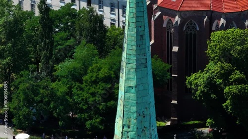 Detailed Aerial Pan: From Gothic Spire to the Historic Market Hall