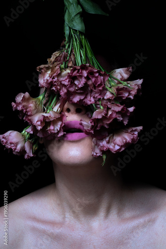 Beauty floral portrait with pink flowers black backdrop modern beauty