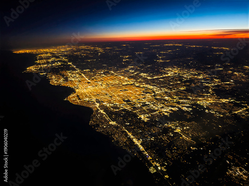 Nighttime sunset view of Milwaukee, Wisconsin viewed from the air with city lights