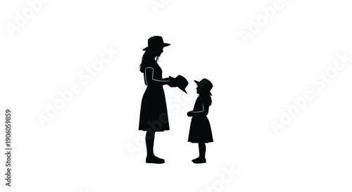 Silhouette of a mother and daughter standing together.
